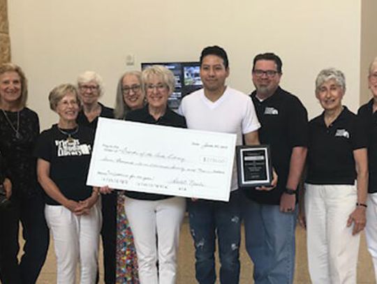 Buda Library receives $7,770 donation from local nail spa