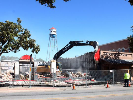 Burnt downtown building demolished