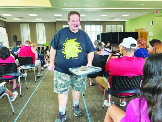 Children learn hiss-tory at Kyle Public Library