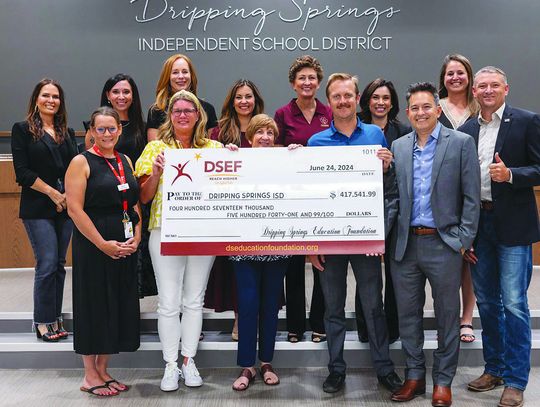 Dripping Springs Education Foundation gives check to Dripping Springs ISD