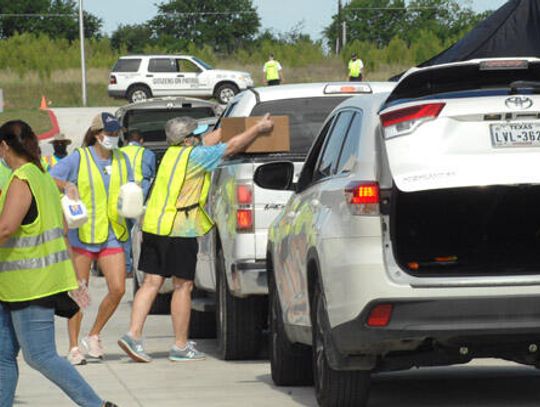 Families receive free food during Kyle distribution event