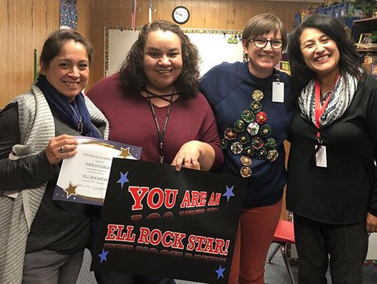 Four staff members honored for bilingual learning work