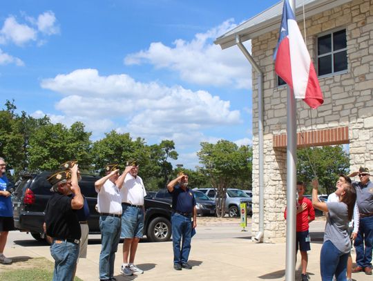 Handle with care Students participate in flag raising ceremony