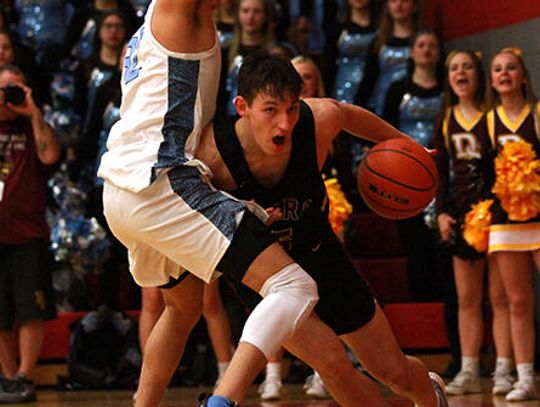 Harlan tops Tiger basketball in area round