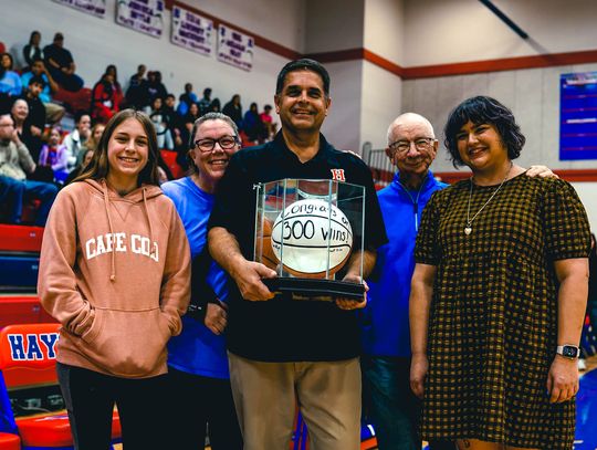 Hays basketball coach celebrates triumph