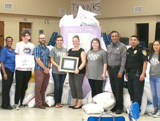 Hays High students collect over 300 pillows for domestic violence victims