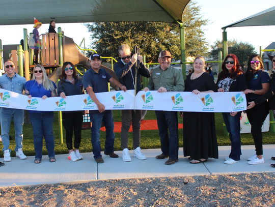 Kyle celebrates Waterleaf playground opening