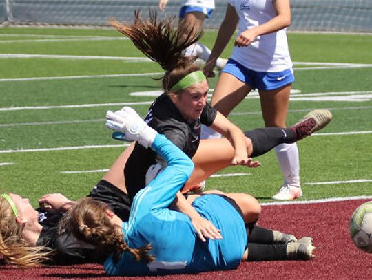 Lady Tigers pinch a St. Patty’s Day win