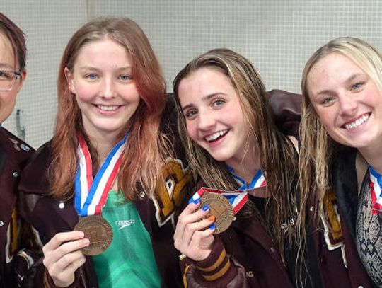 Lady Tigers swim team earns bronze