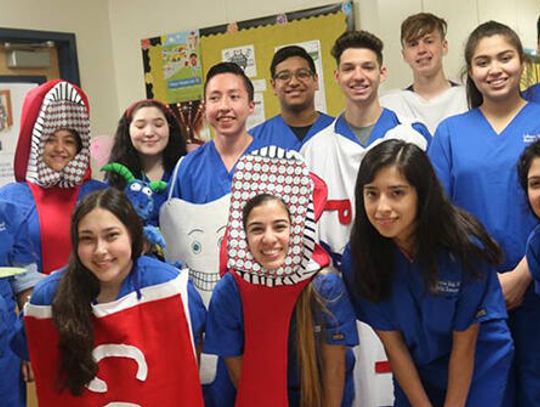 Lobos share the gift of dental hygiene with young Panthers