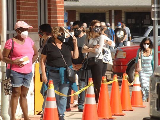 Long lines highlight first day of voting
