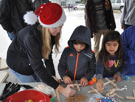 Rainy cheer at annual Christmas on Mercer