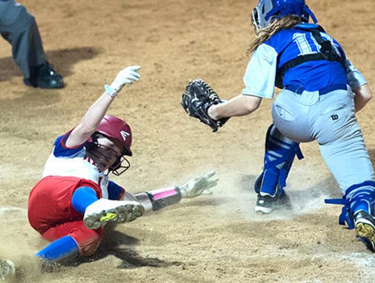 Rebel softball slides past Lobos in 8-7 comeback win