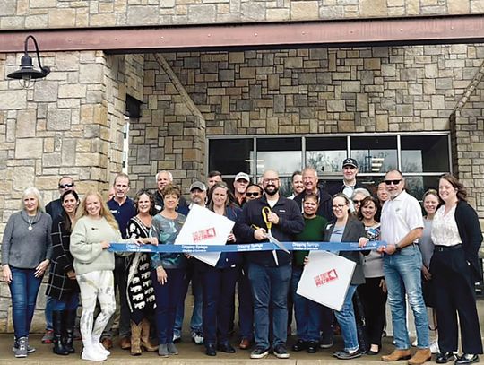 Slice Street Pizza cuts ribbon