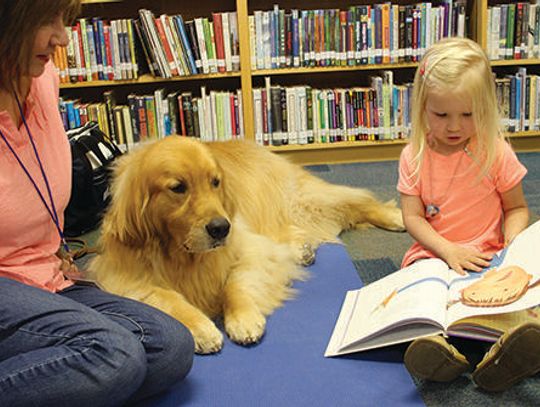 Therapy dog program helps Buda kids build confidence in reading