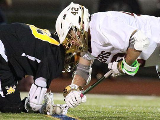 Tiger lacrosse trounces Trojans