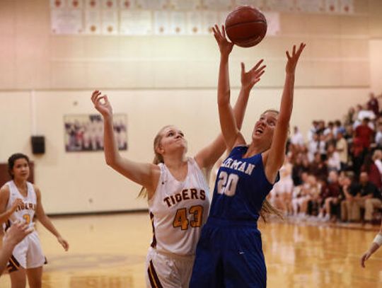 Tigers beat Lobos 64-28