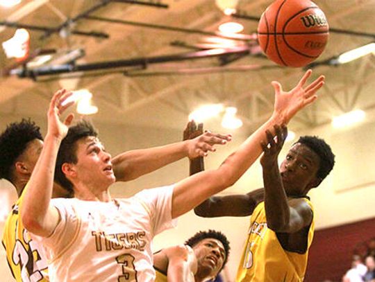 Tigers boys basketball finishes third in district