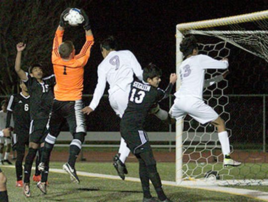 Tigers claw Matadors for season’s first district win