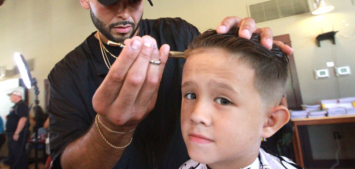 A cut above  Local stylists volunteer to give kids free haircuts
