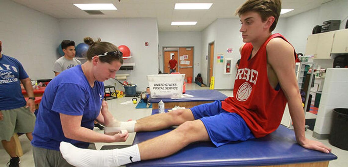 Athletic trainers keep players healthy off and on the field