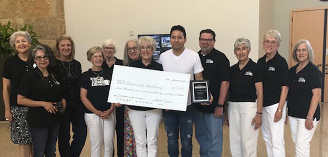 Buda Library receives $7,770 donation from local nail spa