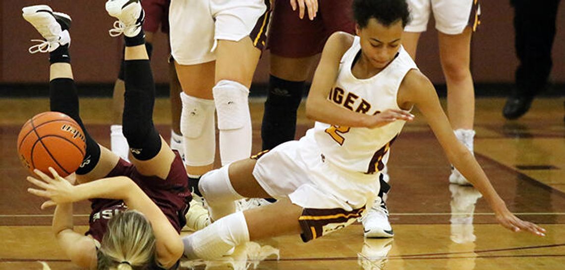 Catching fire  Lady Tigers roll past Rouse 46-33
