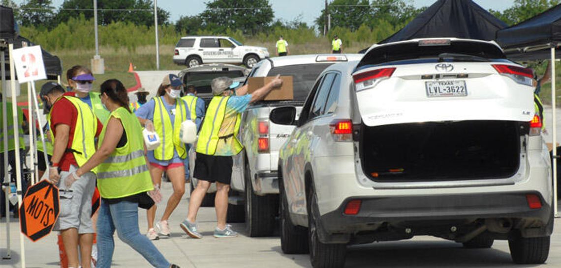 Families receive free food during Kyle distribution event
