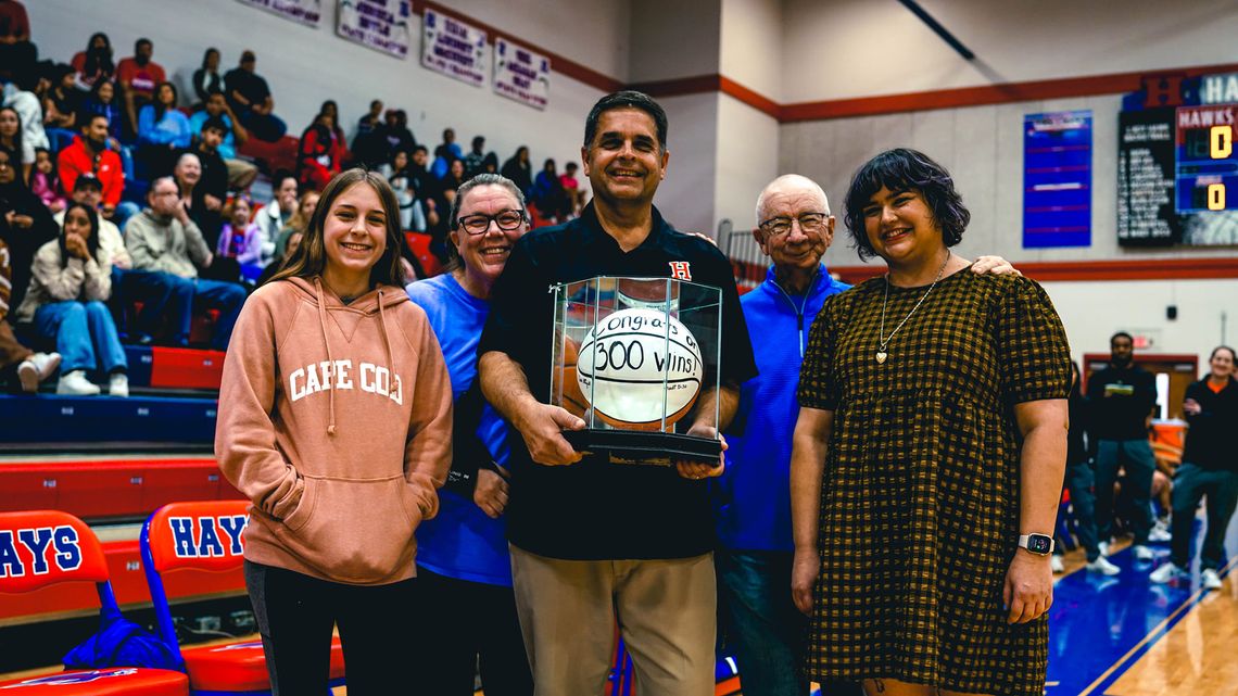 Hays basketball coach celebrates triumph