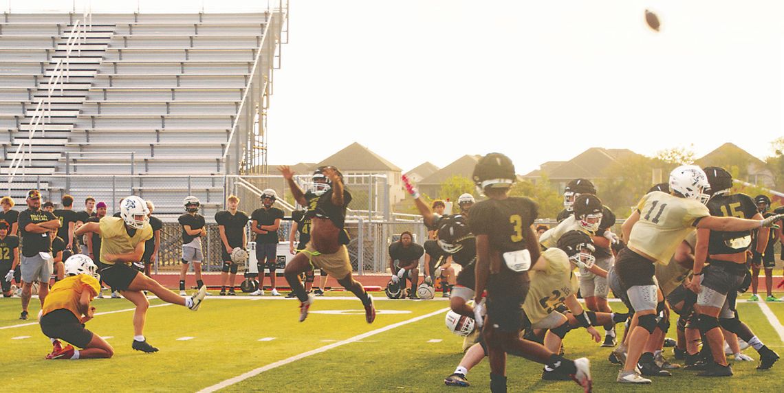 Local football players raise money for childhood cancer research