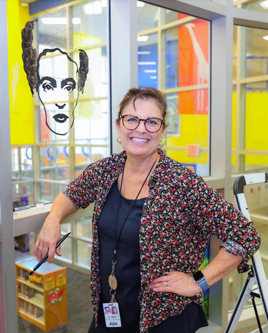 Teacher paints mural at Pfluger Elementary