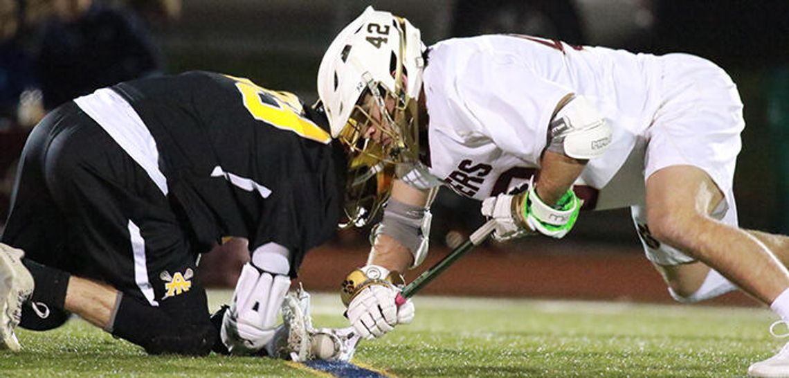 Tiger lacrosse trounces Trojans