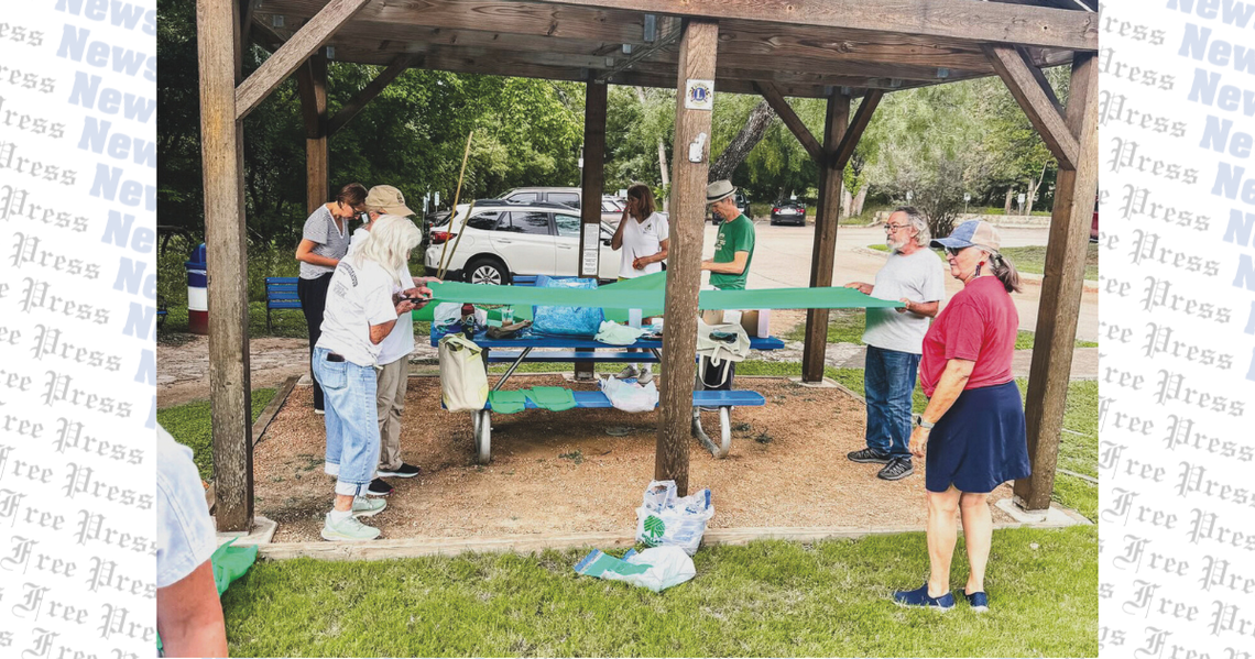 Wimberley locals hang green ribbons, honor flood victims